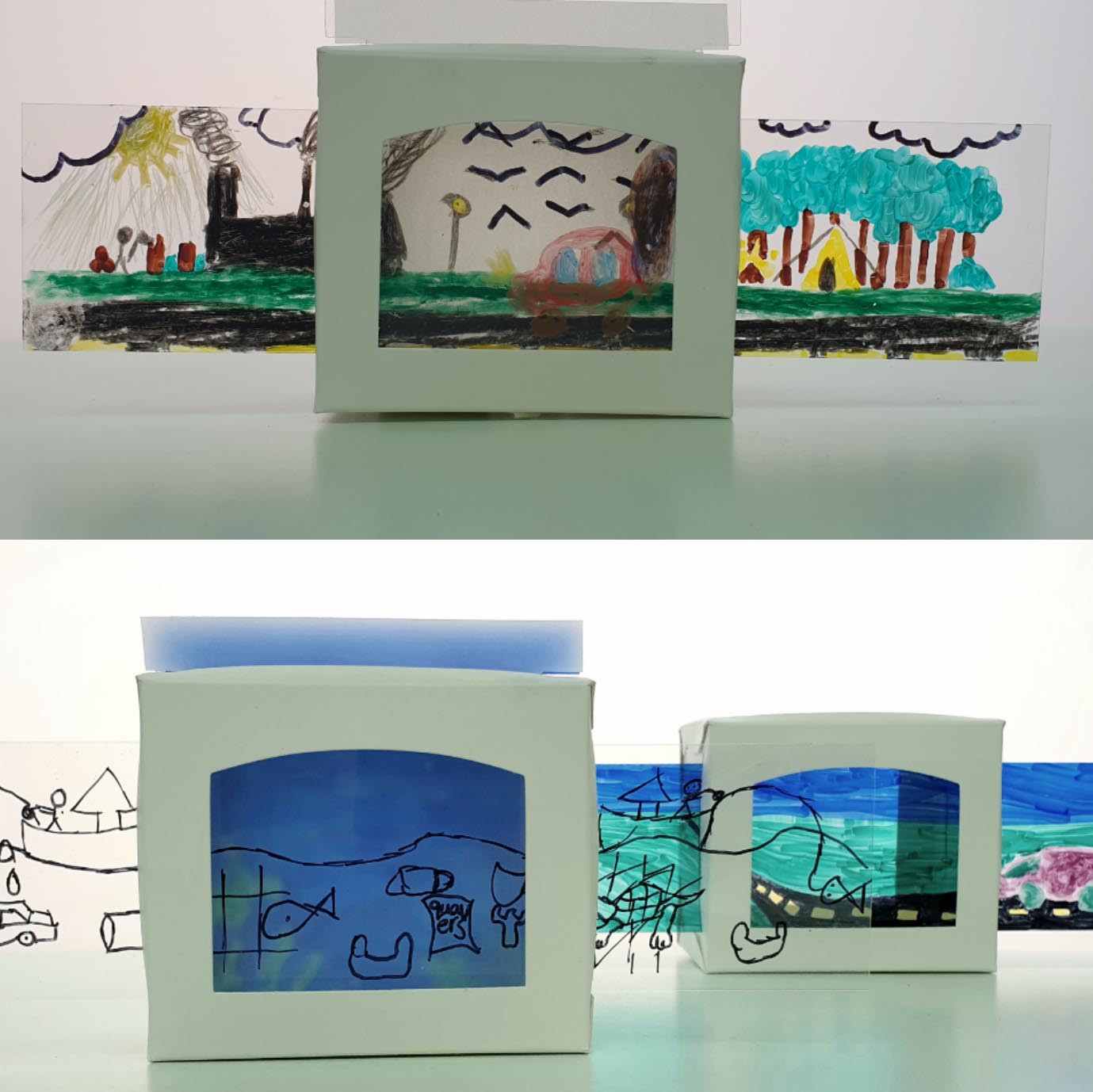Two white card mini theatres with sliding panels of drawings of landscapes by children
